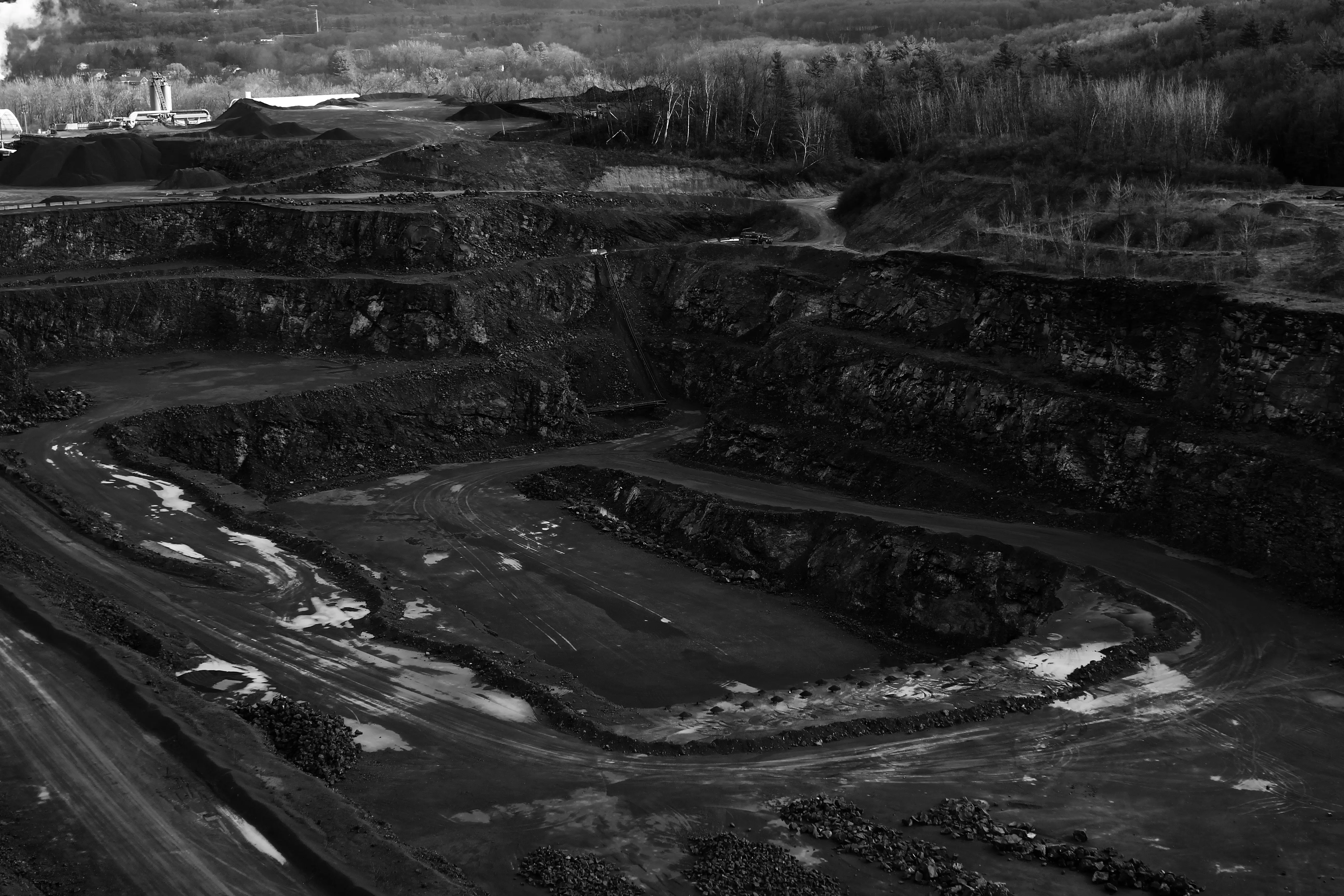 An open-pit mine, black and white